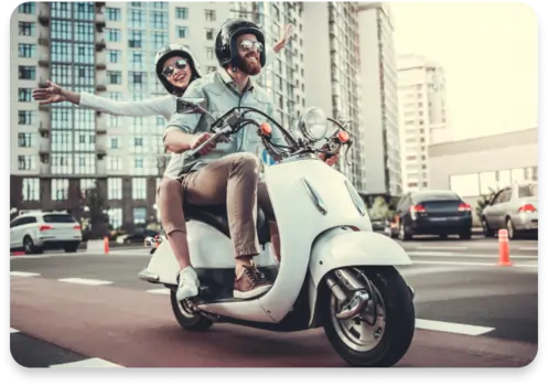man_and_woman_on_scooter